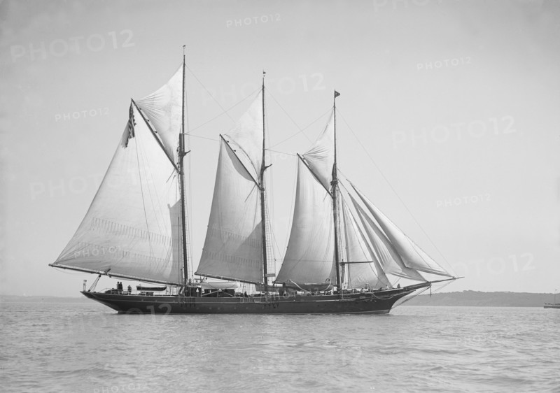 The three-mast auxiliary schooner 'Invincible', 1911. Creator: Kirk & Sons of Cowes.