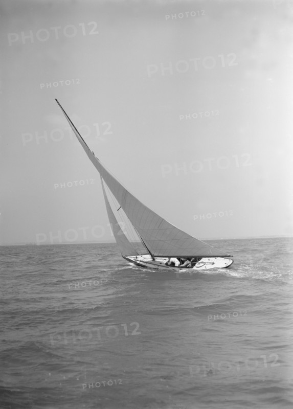 The 6 Metre class 'The Whim' sailing upwind, 1911. Creator: Kirk & Sons of Cowes.