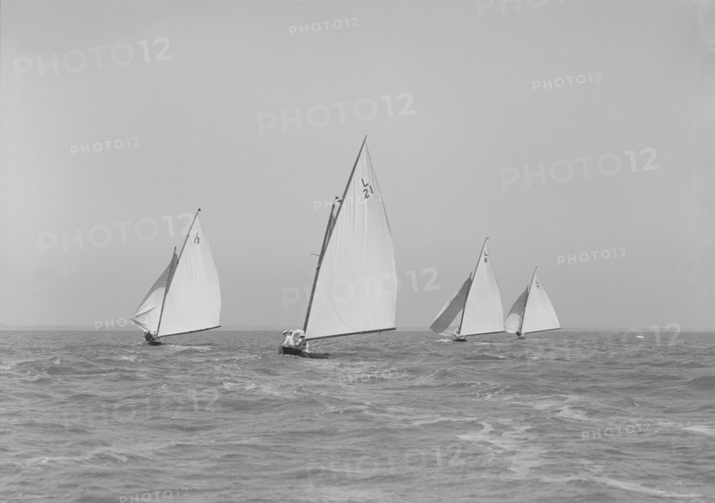 The 6 Metres boats 'Snowdrop', 'The Whim', 'Cheetal' and 'Ejnar' racing downwind. Creator: Kirk & Sons of Cowes.