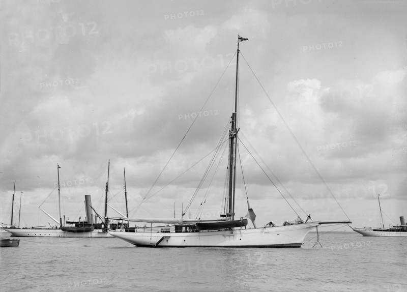 The cutter 'Yolande' at anchor, 1912. Creator: Kirk & Sons of Cowes.