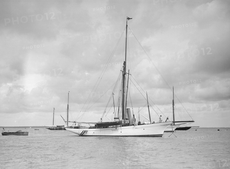 The cutter 'Yolande' at anchor, 1912. Creator: Kirk & Sons of Cowes.