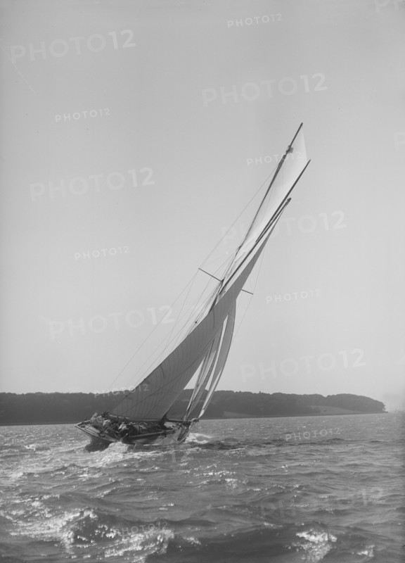 The 15 Metre cutter 'Ostara' sailing close-hauled, 1911. Creator: Kirk & Sons of Cowes.
