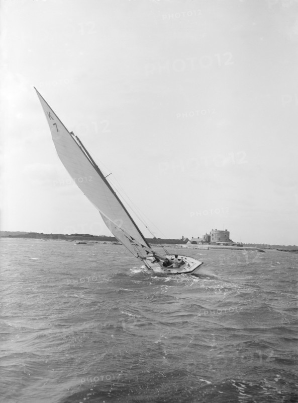 The 7 Metre yacht 'Genevia' (K7) beating to windward, 1912. Creator: Kirk & Sons of Cowes.
