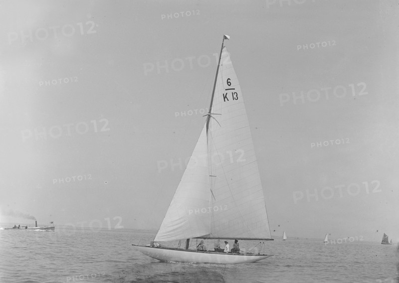 The 6 Metre 'Flya' (K13) sailing close-hauled, 1921. Creator: Kirk & Sons of Cowes.
