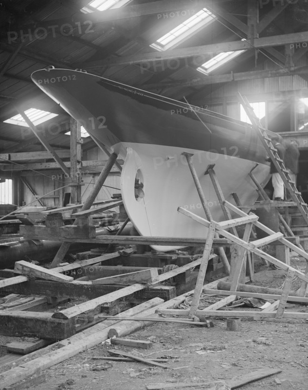 The yawl 'Banzai' in shed at boatyard, 1912. Creator: Kirk & Sons of Cowes.