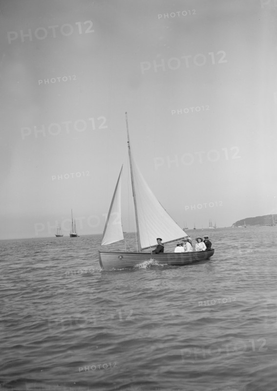 Party sailing on the Earl of Normanton's Cutter, 1911. Creator: Kirk & Sons of Cowes.