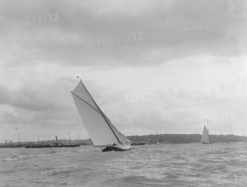 Cutter heeling hard on upwind leg. Creator: Kirk & Sons of Cowes.