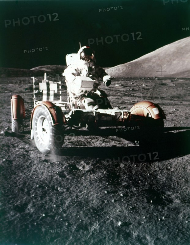 Eugene Cernan using the Rover on the lunar surface, Apollo 17 mission, December 1972. Creator: NASA.