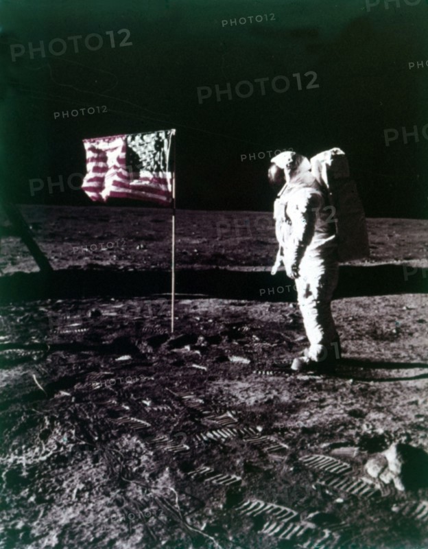 Buzz Aldrin stands next to the American flag on the surface of the Moon, July 1969. Creator: Neil Armstrong.