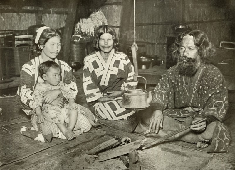 Ainu Man and Women at Home', 1910.