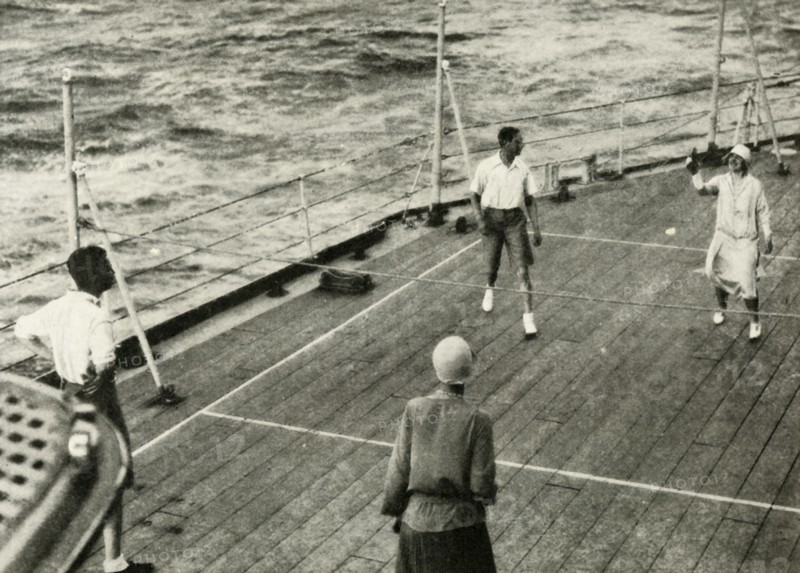 'Their Majesties, in a Game of Deck Quoits on Deck of H.M.S. "Renown", 1927', 1937. Creator: Unknown.