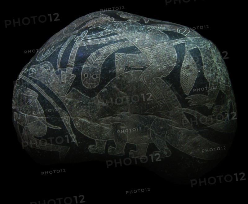 The ica stone. A man killing a dinosaur.