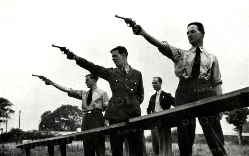 'Revolver practice at the Elementary Flying Training School',1941