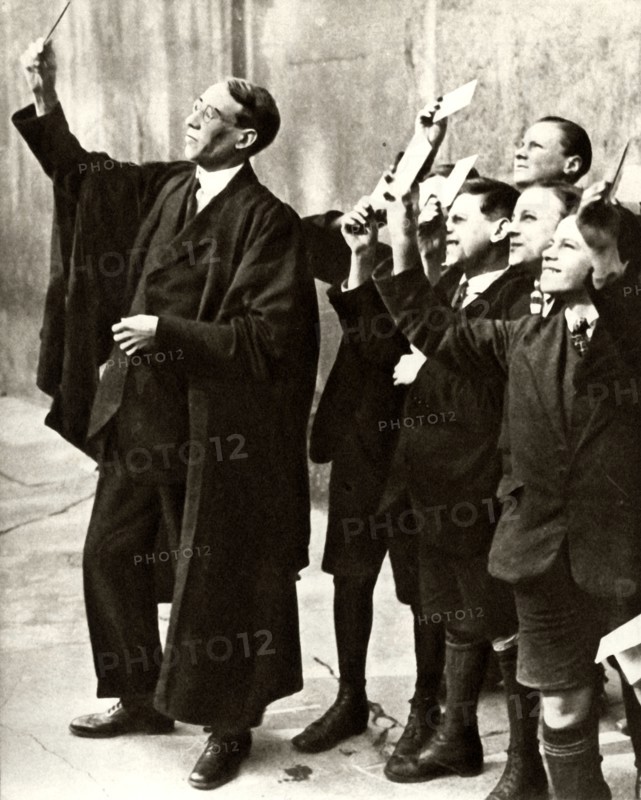 Schoolboys and teacher observing a solar eclipse, Britain