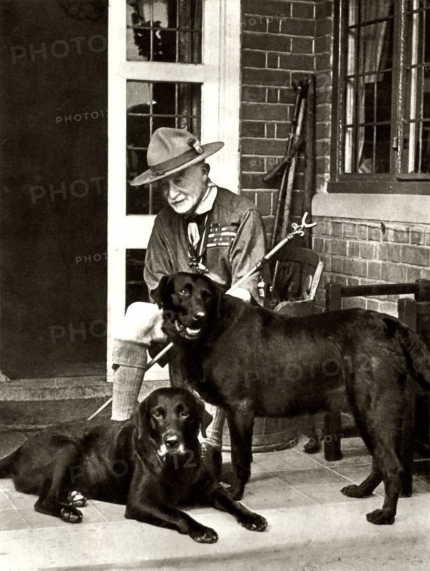 Robert Baden-Powell at home with his dogs, c1929
