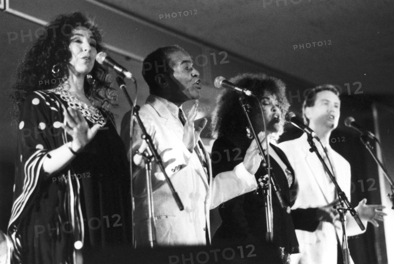 Jon Hendricks with three unidentified singers, c1998. Creator: Brian Foskett.
