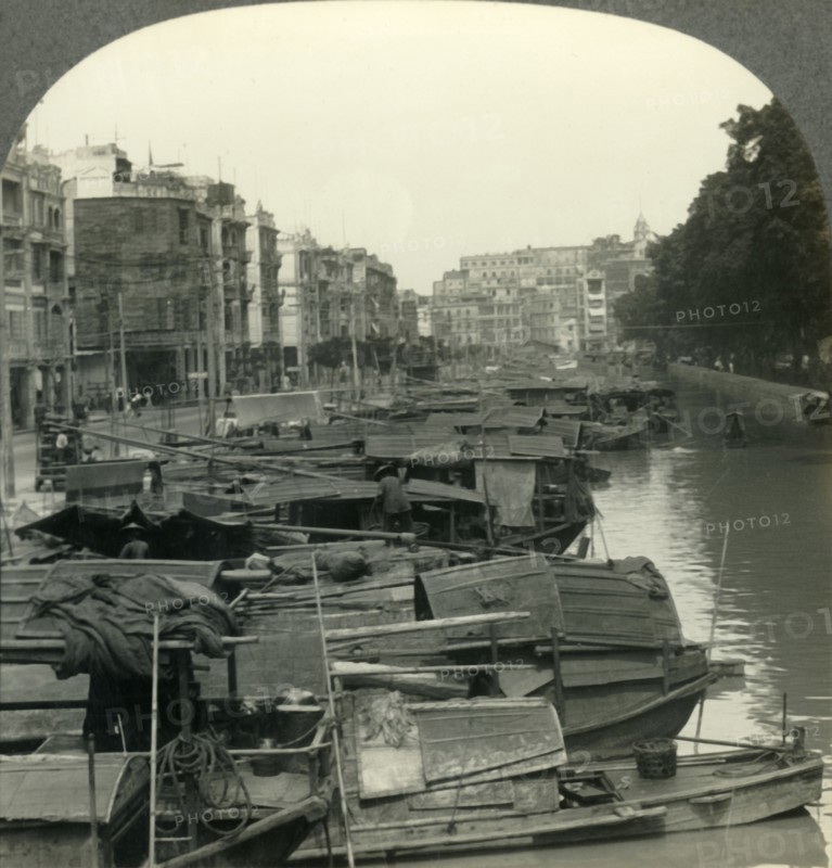 'The Canal between Canton and the Island of Shameen, China', c1930s. Creator: Unknown.