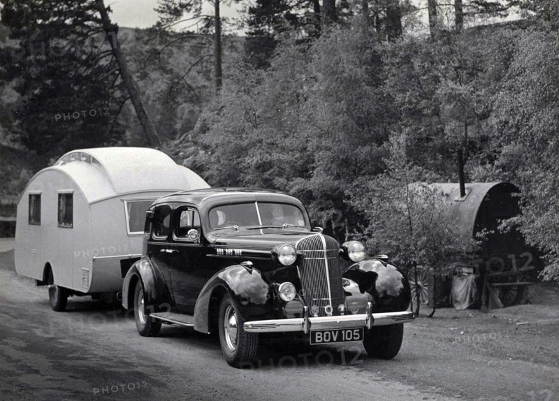 1936 Oldsmobile Eight with caravan in Scotland. Creator: Unknown.