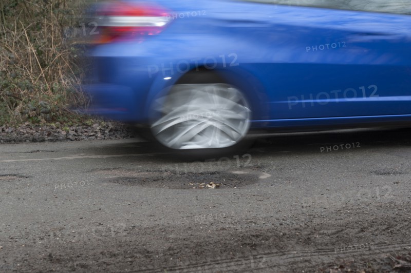 Pot holes in road surface 2017. Creator: Unknown.