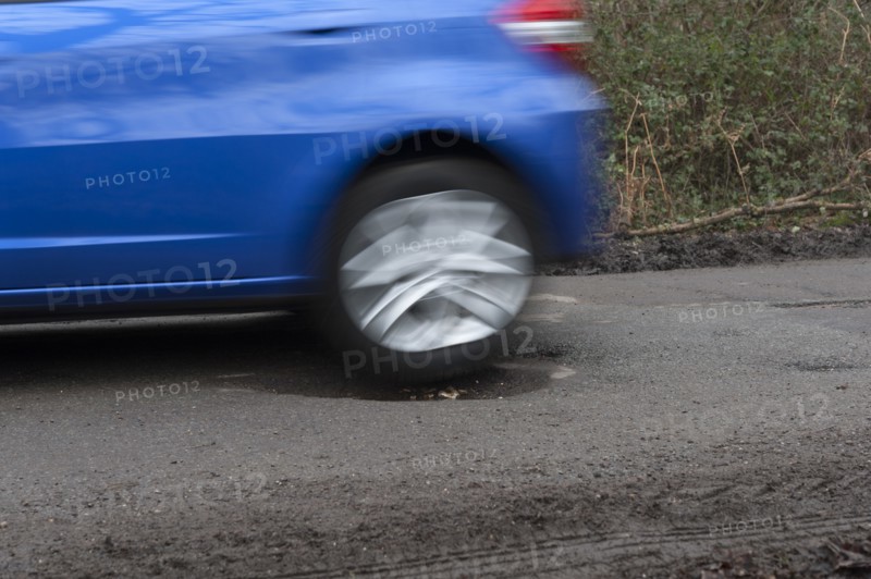 Pot holes in road surface 2017. Creator: Unknown.