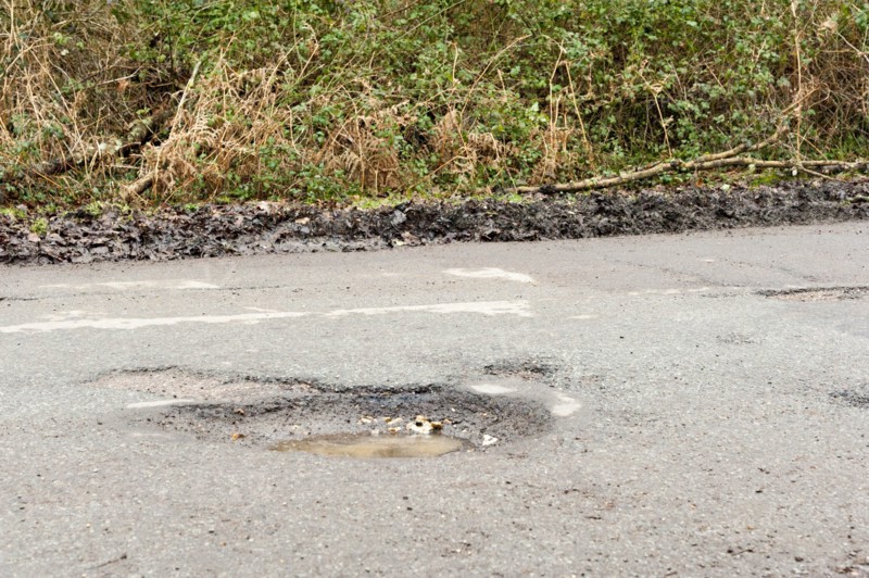 Pot holes in road surface 2017. Creator: Unknown.