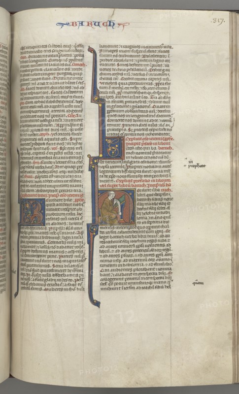 Fol. 317r, Baruch, historiated initial H, Baruch seated at a desk writing on a scroll, c. 1275-1300. Creator: Unknown.