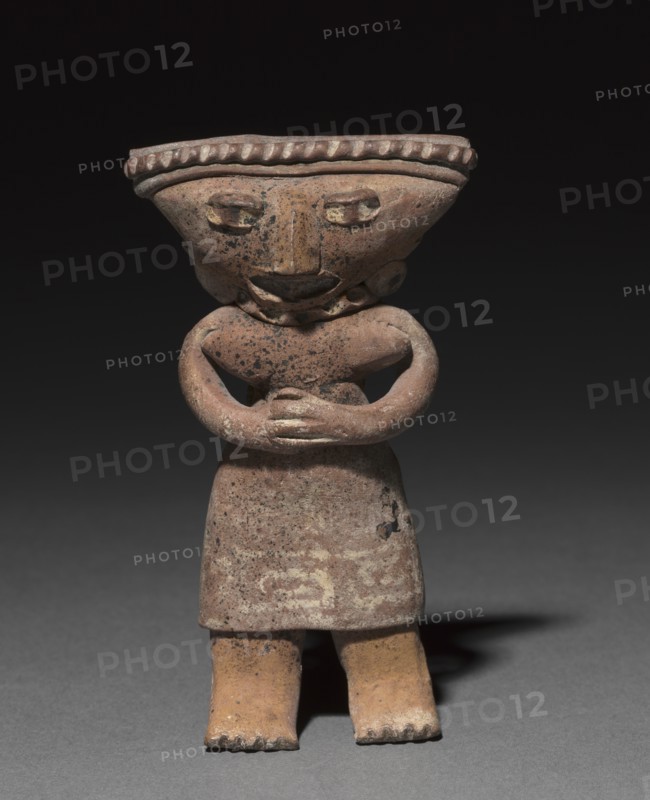 Standing figurine holding an animal (dog?), 300 B.C. to A.D. 300. Creator: Unknown.