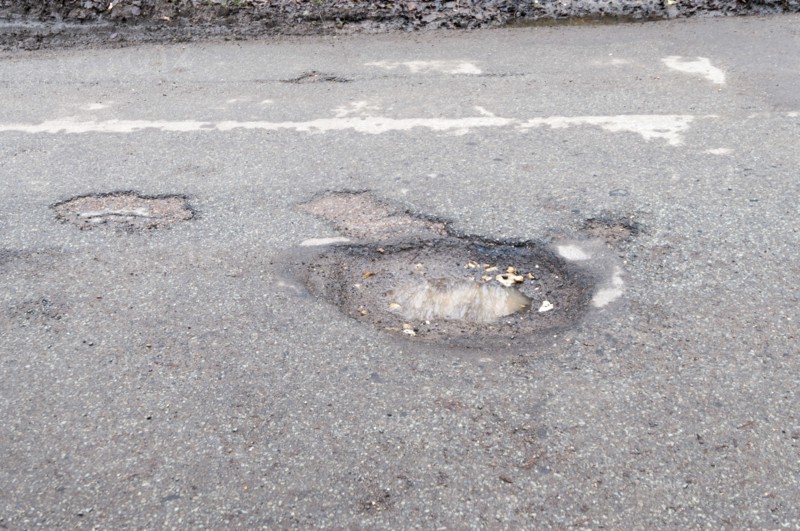 Pot holes in road surface 2017. Creator: Unknown.