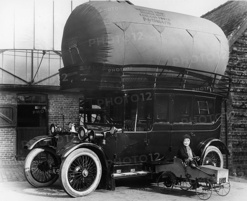 1913 Lanchester with gas bag conversion and boy in pedal car. Creator: Unknown.