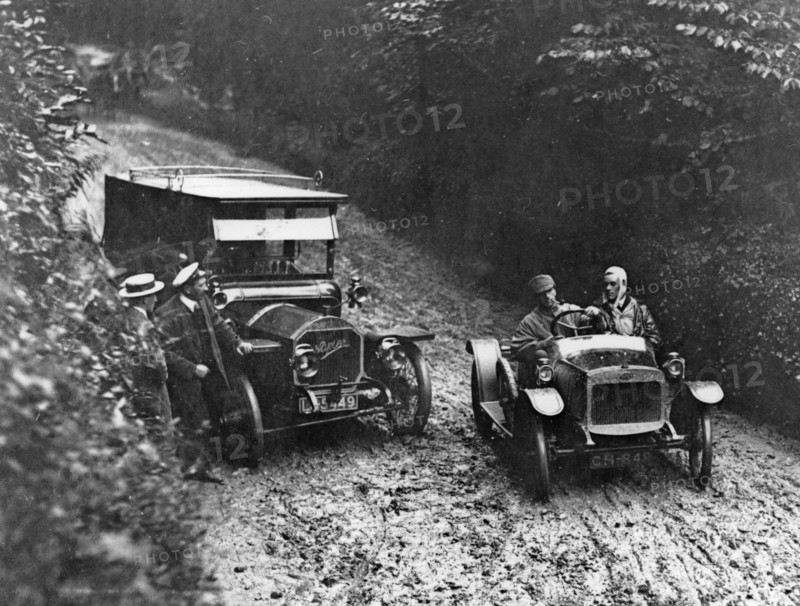 G.W.K passing Napier on very muddy track circa 1915. Creator: Unknown.