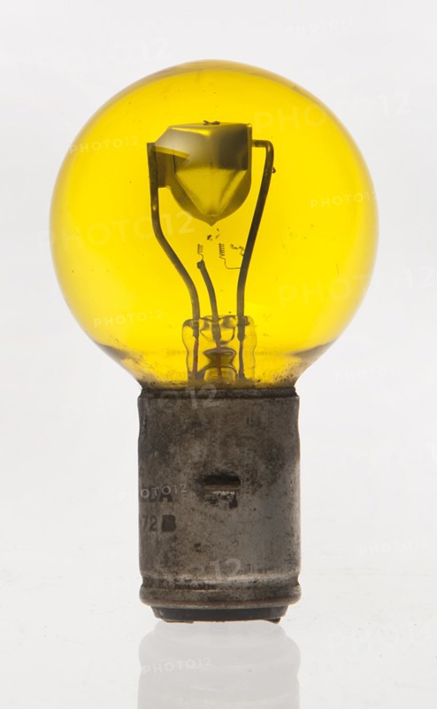 Yellow headlamp bulb. Creator: Unknown.