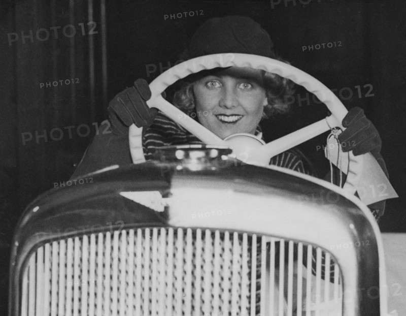 Female model in Hillman Minx at 1933 Motor Show. Creator: Unknown.