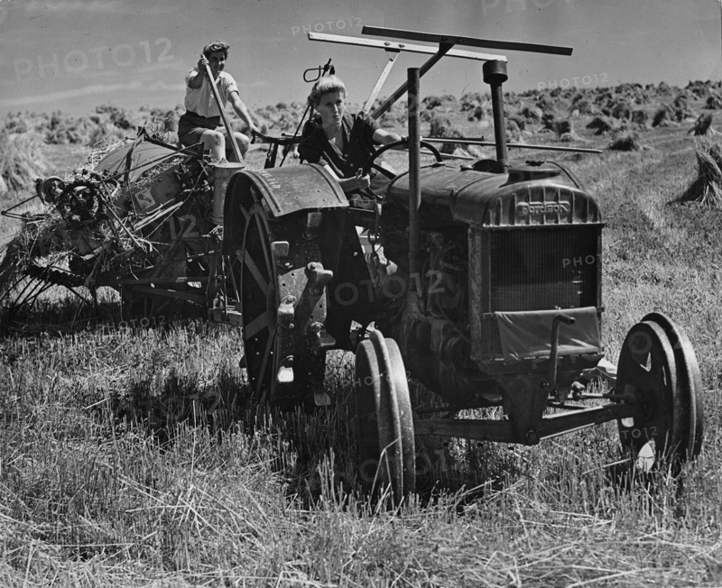Fordson tractor, with Land girls 1940's. Creator: Unknown.