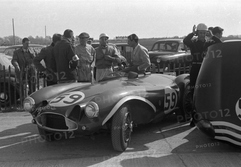 Aston Martin DB3S, Stirling Moss in paddock at Goodwood International Sports Car Race 1956. Creator: Unknown.
