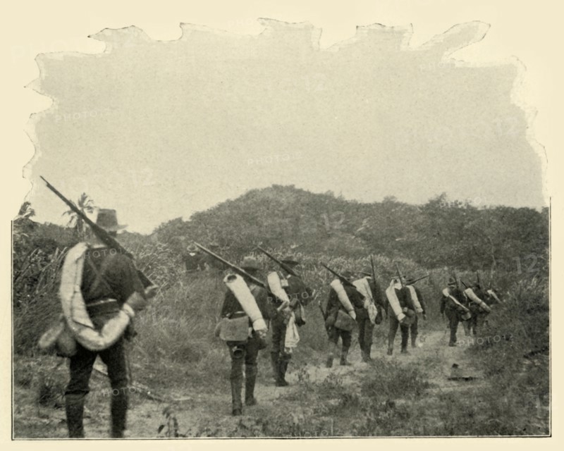 'On the Way from Battlefield of 1st and 10th to "Rough Riders" Scene of Conflict, over the Mountains Creator: Burr McIntosh.