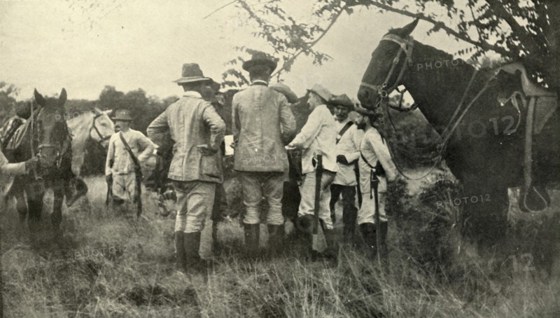 'General Lawton Learning from Cuban Officers...June 30th', Spanish-American War, 1898, (1899). Creator: Burr McIntosh.