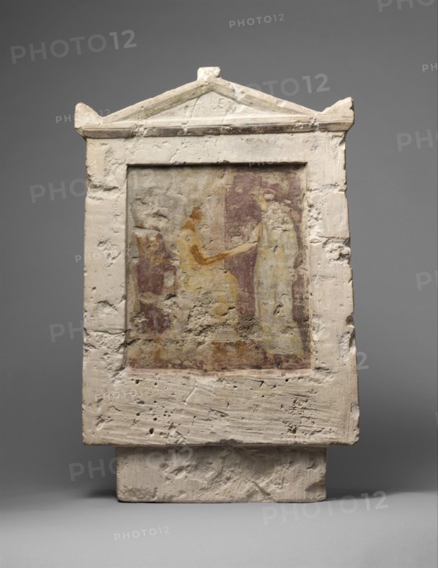 Painted limestone funerary stele with a seated man and two standing..., late 4th-early 3rd century B Creator: Unknown.