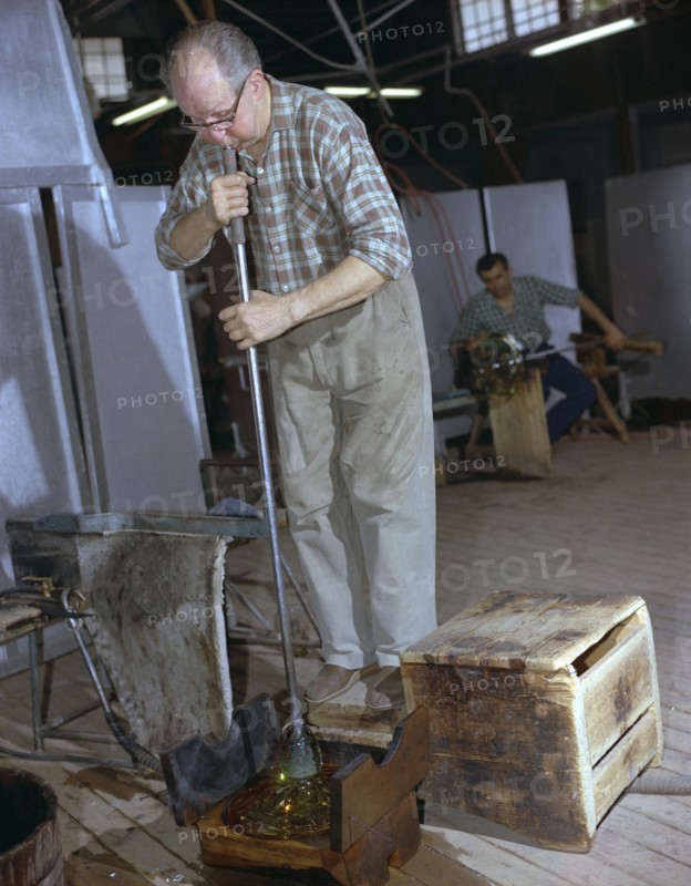 A glass blower at Strombergshyttan's glassworks, Sweden, 1950s. Creator: Unknown.
