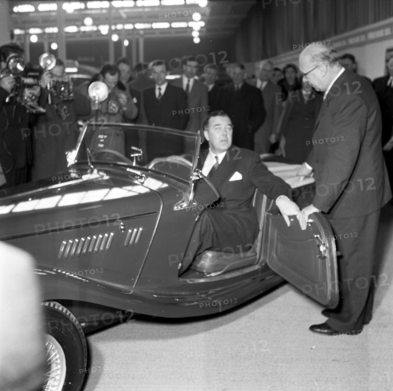 Prince Bertil tests a convertible at the car showroom in Stockholm, Sweden, 1954.  Creator: Unknown.