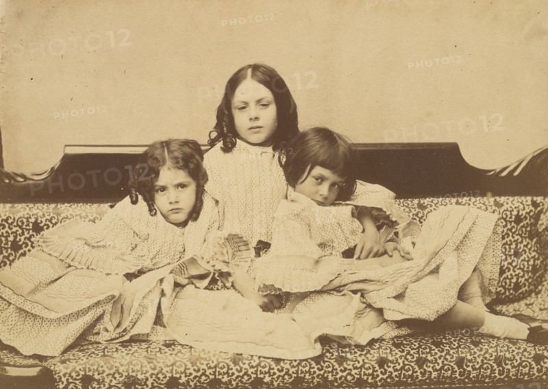 Edith, Ina and Alice Liddell on a Sofa, Summer 1858.