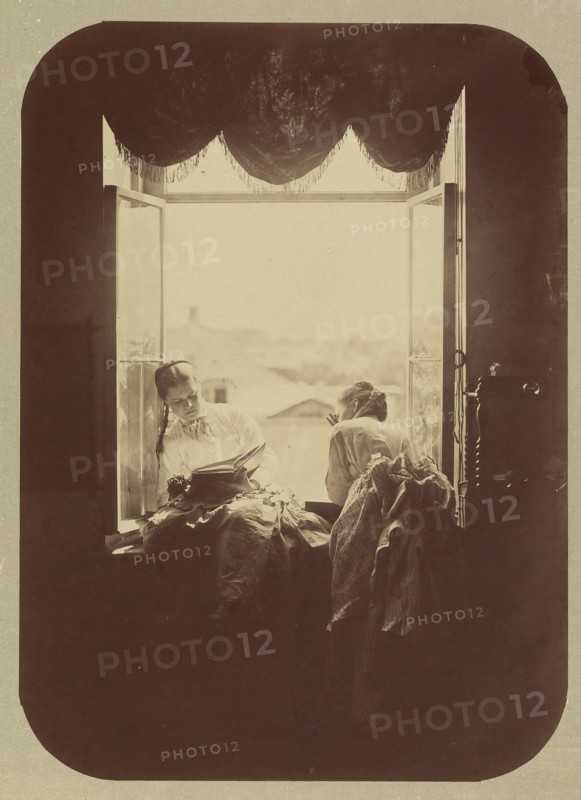 [Two Young Women at Window], ca. 1870.
