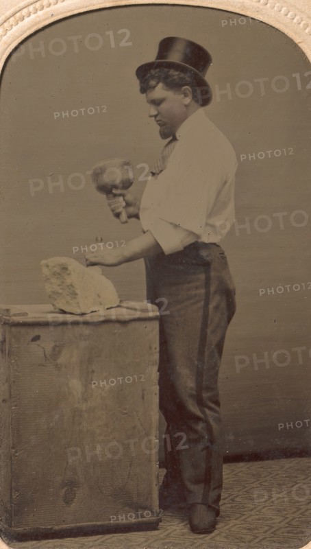 Mason in Top Hat with Mallet, Chisel, and Piece of Stone, 1870s-80s.