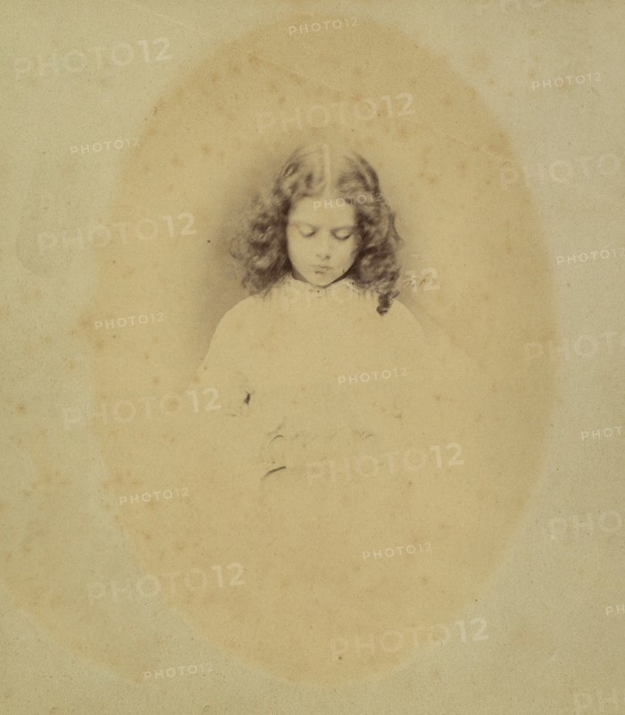 Edith Liddell Seated Beside a Vase of Foxgloves, 1860.
