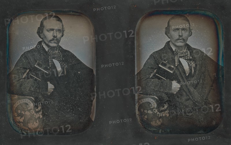 Stereoscopic Portrait of Man Holding Stereoscopic Viewer, 1840s-60s.