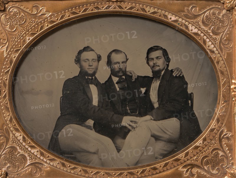 Three Seated Men with Arms Around Each Other, 1860s.
