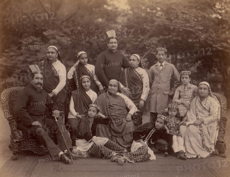 Formal Family Portrait of Thirteen People, Men in European Dress, 1860s-70s.