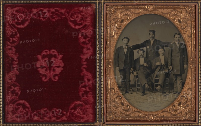 Policeman Posing with Four "Collared" Thugs, ca. 1875.