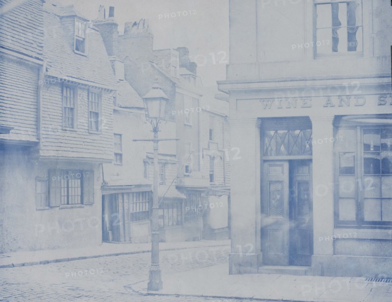 [Street with Lamp Post and Wine Shop], 1850s.