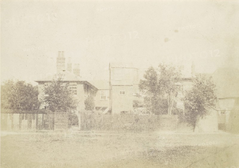 Compound of Buildings Surrounded By Fence, 1850s.