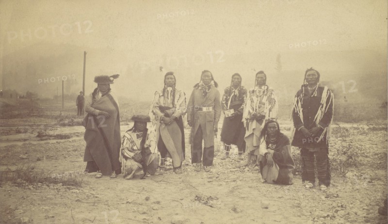 Group of Native American Men, Telegraph Poles in Background, 1880s-90s.